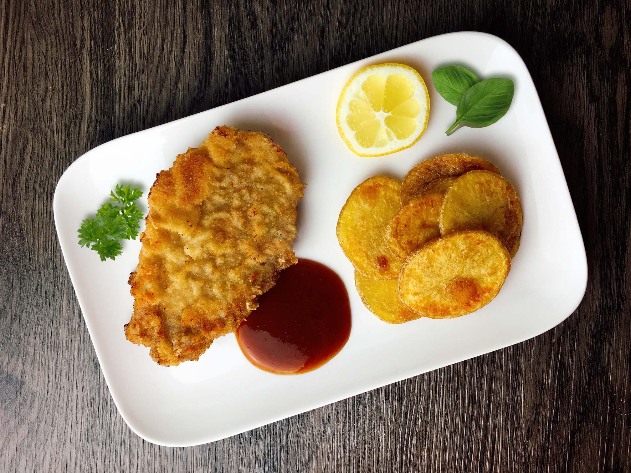 Schnitzel Wiener Art Rezept | Paniertes Schweineschnitzel